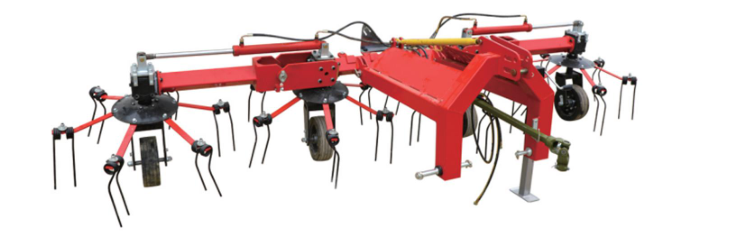 トラクターに取り付けられたロータリー干し草レーキ